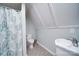 Cozy bathroom featuring patterned floors, a shower with a patterned curtain, and white fixtures at 501 Pee Dee Ave, Albemarle, NC 28001