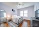 Cozy bedroom featuring a comfortable bed and hardwood floors at 501 Pee Dee Ave, Albemarle, NC 28001