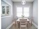 Bright dining room featuring a table set for three and beautiful patterned flooring at 501 Pee Dee Ave, Albemarle, NC 28001