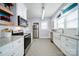 Modern kitchen with stainless steel appliances, granite countertops, and white cabinetry at 501 Pee Dee Ave, Albemarle, NC 28001
