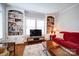 Cozy living room featuring built-in bookshelves and ample natural light at 501 Pee Dee Ave, Albemarle, NC 28001
