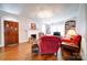 Comfortable living room with a fireplace, hardwood floors, and ample seating at 501 Pee Dee Ave, Albemarle, NC 28001
