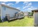The home's backyard features a deck, sunroom, and sunny exposure perfect for entertaining at 5141 Grays Ridge Dr, Charlotte, NC 28269