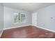 This bedroom offers a large window and hardwood floors at 5141 Grays Ridge Dr, Charlotte, NC 28269
