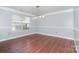 Dining room features wood floors, natural light, and chair rail at 5141 Grays Ridge Dr, Charlotte, NC 28269