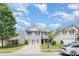 Well-maintained two-story home with a manicured lawn and ample parking space at 5141 Grays Ridge Dr, Charlotte, NC 28269