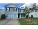 Charming two-story home featuring a well-maintained lawn and classic architectural details at 5141 Grays Ridge Dr, Charlotte, NC 28269