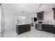 Modern kitchen with stainless steel appliances, tile backsplash and eat-in island at 5141 Grays Ridge Dr, Charlotte, NC 28269