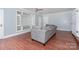 Elegant living room featuring hardwood floors, a neutral color scheme, and built-in shelving at 5141 Grays Ridge Dr, Charlotte, NC 28269