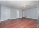 Large living room features wood floors, neutral walls, and recessed lighting at 5141 Grays Ridge Dr, Charlotte, NC 28269