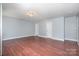 Open living room features wood floors, neutral walls, and recessed lighting at 5141 Grays Ridge Dr, Charlotte, NC 28269
