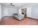 Well-lit living room with hardwood floors and an open design to the fireplace at 5141 Grays Ridge Dr, Charlotte, NC 28269