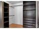 Spacious closet featuring dark wood organizers and ample storage options at 5229 Mt Holly Huntersville Rd, Charlotte, NC 28216