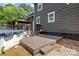 Home exterior features a deck leading to backyard; pool equipment is nearby, as is a gazebo at 5229 Mt Holly Huntersville Rd, Charlotte, NC 28216