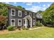 Beautiful two-story home with a gray facade, white-framed windows, and a well-manicured lawn at 5229 Mt Holly Huntersville Rd, Charlotte, NC 28216