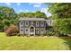 Charming two-story home featuring a lush green lawn and freshly planted landscaping at 5229 Mt Holly Huntersville Rd, Charlotte, NC 28216