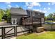 Home exterior features a deck leading to backyard; pool is nearby, as is a gazebo at 5229 Mt Holly Huntersville Rd, Charlotte, NC 28216
