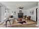 Comfortable living room showcasing a fireplace, stylish seating, and bright natural light at 5229 Mt Holly Huntersville Rd, Charlotte, NC 28216