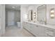 Luxurious bathroom with double vanities, modern fixtures, and a separate shower and soaking tub at 536 Hillside Ave, Charlotte, NC 28209