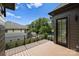 Wide deck view showcasing neighborhood houses and green trees at 536 Hillside Ave, Charlotte, NC 28209