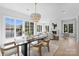 Bright dining area with large windows, stylish lighting, and easy access to the outdoor space at 536 Hillside Ave, Charlotte, NC 28209