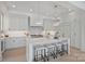 Bright, all-white kitchen with a large center island, modern appliances, and stylish pendant lighting at 536 Hillside Ave, Charlotte, NC 28209