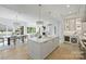 Spacious kitchen featuring an island, modern stainless steel appliances, wine storage and open dining and living areas at 536 Hillside Ave, Charlotte, NC 28209