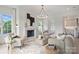 Bright living room featuring hardwood floors, fireplace, neutral decor, and open layout at 536 Hillside Ave, Charlotte, NC 28209