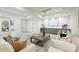 Bright living room featuring modern furnishings, a stylish wet bar, and light wood floors at 536 Hillside Ave, Charlotte, NC 28209