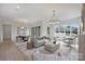 Spacious living room with hardwood floors, modern lighting, and open layout leading to the dining area at 536 Hillside Ave, Charlotte, NC 28209