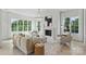 Bright living room with large windows, fireplace, neutral decor, and hardwood floors at 536 Hillside Ave, Charlotte, NC 28209
