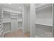 Spacious walk-in closet with custom shelving, drawers, and ample storage space for an organized wardrobe at 536 Hillside Ave, Charlotte, NC 28209