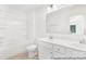 Bright bathroom offers a tub and shower, vanity, and updated lighting fixtures at 5630 Galloway Dr # 49, Stanfield, NC 28163
