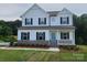 Charming two-story home with a welcoming front porch and classic architectural details at 5630 Galloway Dr # 49, Stanfield, NC 28163