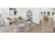 Open-concept living room with stylish furniture and hardwood floors that flow into other living areas at 5630 Galloway Dr # 49, Stanfield, NC 28163