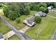 Overhead shot of a quaint home featuring a lush lawn, mature trees, and an inviting driveway at 5678 Cedar Run Dr, Denver, NC 28037