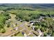 Aerial view of the property in a wooded neighborhood with tree coverage at 5678 Cedar Run Dr, Denver, NC 28037