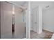 Clean bathroom features a glass shower, tile floors, and a crisp white door, offering functionality at 5678 Cedar Run Dr, Denver, NC 28037