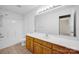 Clean bathroom with a combination tub and shower, plus a long vanity, offering functionality at 5678 Cedar Run Dr, Denver, NC 28037