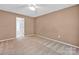 Bright bedroom features neutral walls and plush carpeting, creating a cozy and inviting atmosphere at 5678 Cedar Run Dr, Denver, NC 28037