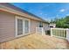 View of wooden deck with white railing and French doors leading into the home at 5678 Cedar Run Dr, Denver, NC 28037