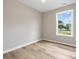 Bright bedroom with hardwood floors and a window with a view of the neighborhood at 6022 Windsong Way, Wingate, NC 28174
