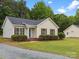 Charming single-story home with well-maintained lawn and detached garage at 6022 Windsong Way, Wingate, NC 28174