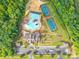 A community pool and two tennis courts surrounded by lush greenery and trees at 640 Mackenzie Falls Dr, Fort Mill, SC 29715
