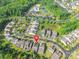 A residential neighborhood with mature trees, manicured lawns, and access to community amenities at 640 Mackenzie Falls Dr, Fort Mill, SC 29715