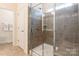 Modern bathroom features a glass enclosed shower with tiled walls and built-in bench at 640 Mackenzie Falls Dr, Fort Mill, SC 29715