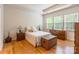 Bright bedroom with tray ceilings, neutral walls, and hardwood floors at 640 Mackenzie Falls Dr, Fort Mill, SC 29715