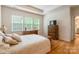 Bedroom with wooden dresser, a wicker chest and neutral decor at 640 Mackenzie Falls Dr, Fort Mill, SC 29715