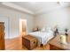 Well lit bedroom features hardwood floors and a ensuite bathroom at 640 Mackenzie Falls Dr, Fort Mill, SC 29715