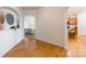 Bright foyer with hardwood floors leading to the living area and kitchen with breakfast bar at 640 Mackenzie Falls Dr, Fort Mill, SC 29715